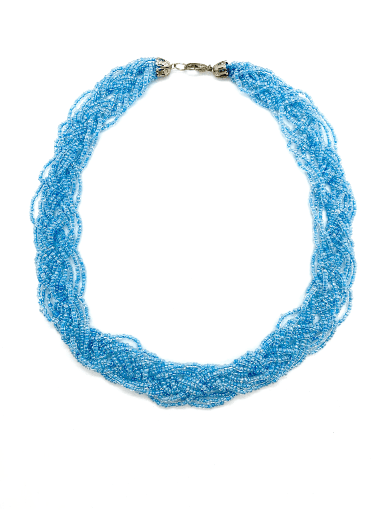 Dive into the ocean's depths with this beautiful blue beaded necklace. The intricate design and shimmering color will add a touch of coastal elegance to your outfit.