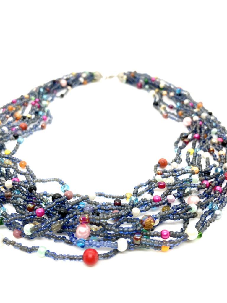 A multi-strand beaded necklace with a mix of blue, purple, and red beads.