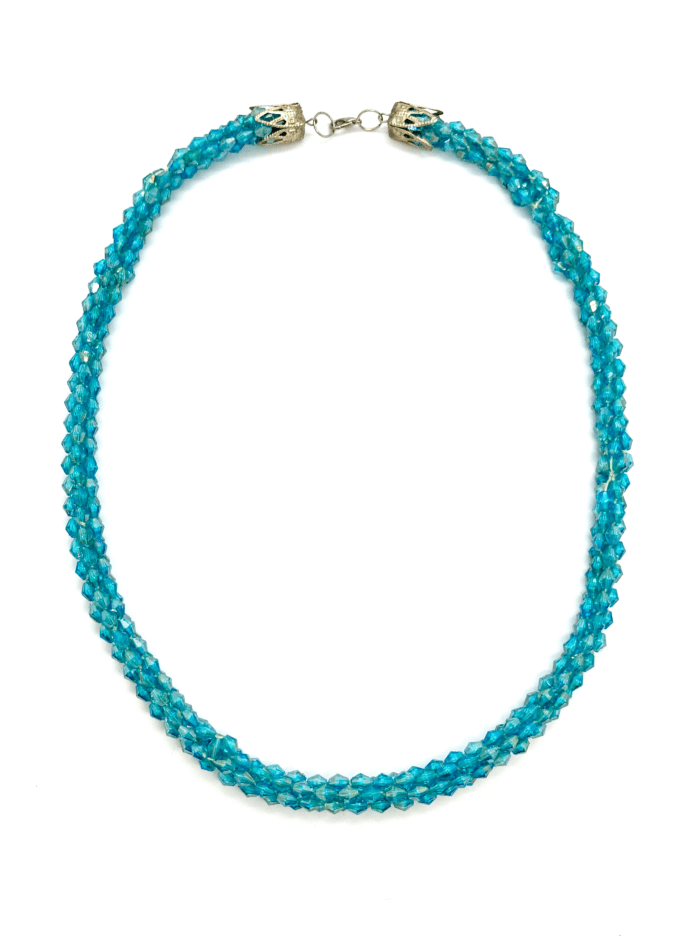 A vibrant turquoise beaded necklace with a twisted design.