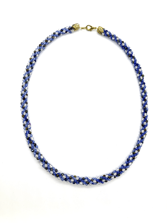 A blue and silver beaded necklace with a twisted design.