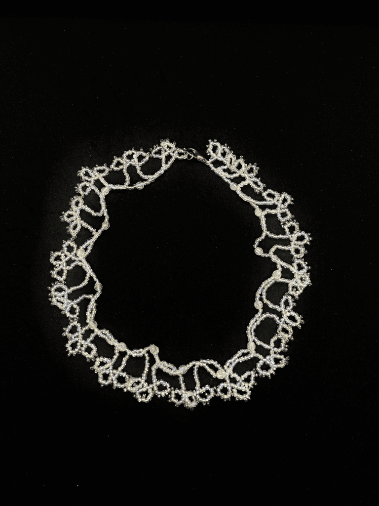 A vintage-inspired beaded necklace with a delicate and feminine design.