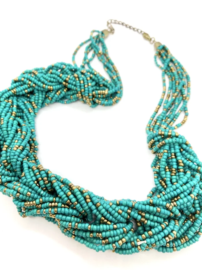 This is another view of the full necklace, showing how the multiple strands come together. The intricate beading and the way the strands twist and intertwine create a beautiful, eye-catching focal point. This type of statement necklace would complement a simple outfit and draw attention to the face.